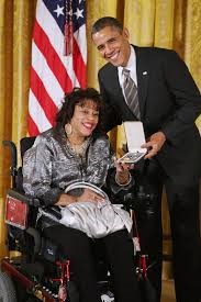 Photo of Janice receiving the Citizens Medal from President Barack Obama